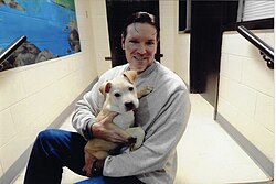 Doug Gilding with service dog trainee Blondie