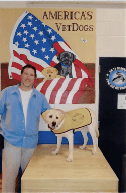 Doug Gilding with service dog trainee Captain